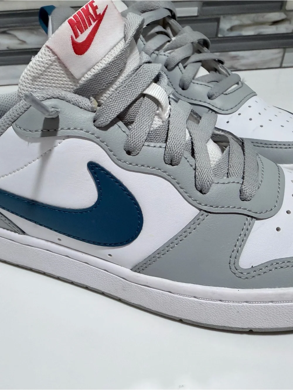 Nike Low-Top Sneakers in White, Gray, and Navy